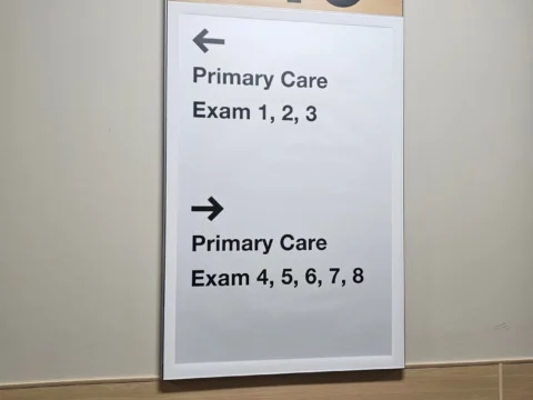 Building 19 directional sign for primary care exam rooms