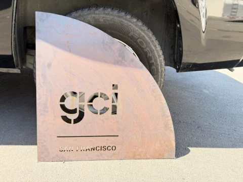 Custom GCI metal logo panel prepared for installation