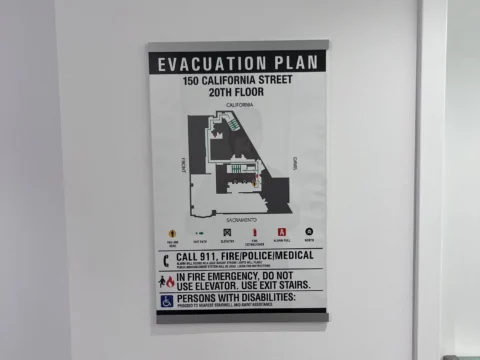 Building evacuation plan installed beside an interior doorway