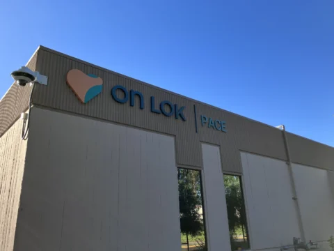 Side view of On Lok PACE building identification signage