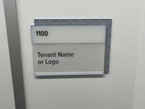 Tenant name and logo identification sign for room 1100