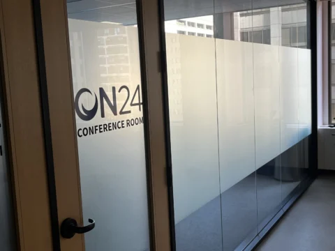 ON24 conference room logo with frosted privacy film on glass