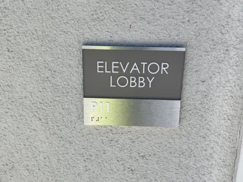 Metal elevator lobby identification plaque