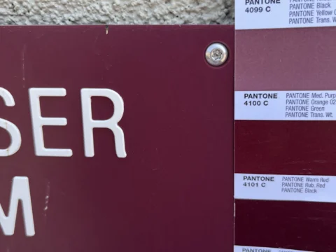 Dimensional letter color proof compared with Pantone swatches