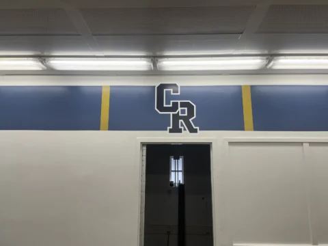GR dimensional letters and stripe graphics above a doorway