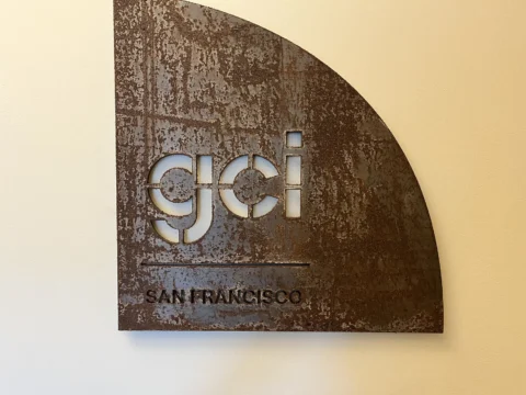 GCI San Francisco dimensional metal logo sign on a textured panel
