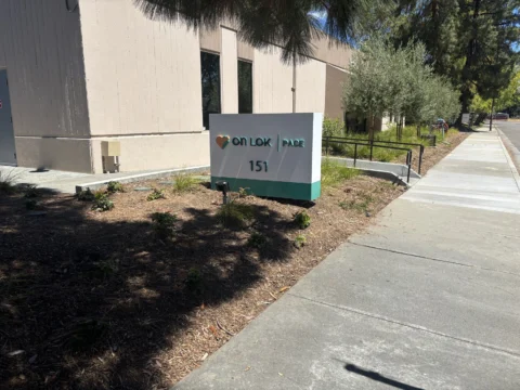 Angled view of the On Lok 151 exterior monument sign