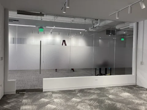 Privacy film installation on glass office and conference room walls