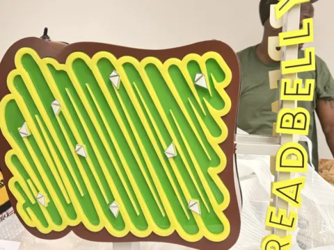 Close view of Breadbelly blade sign components during fabrication
