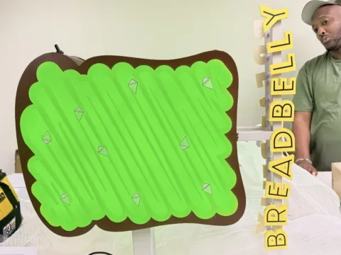 Breadbelly illuminated blade sign shown during fabrication and assembly
