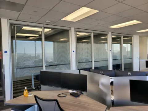 Striped privacy film providing screening across a row of glass office fronts