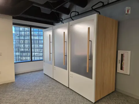 Frosted privacy film applied to individual workplace privacy booths